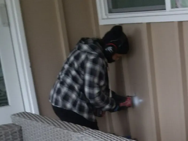 Professional electrician installing an exterior outlet in Murraysville