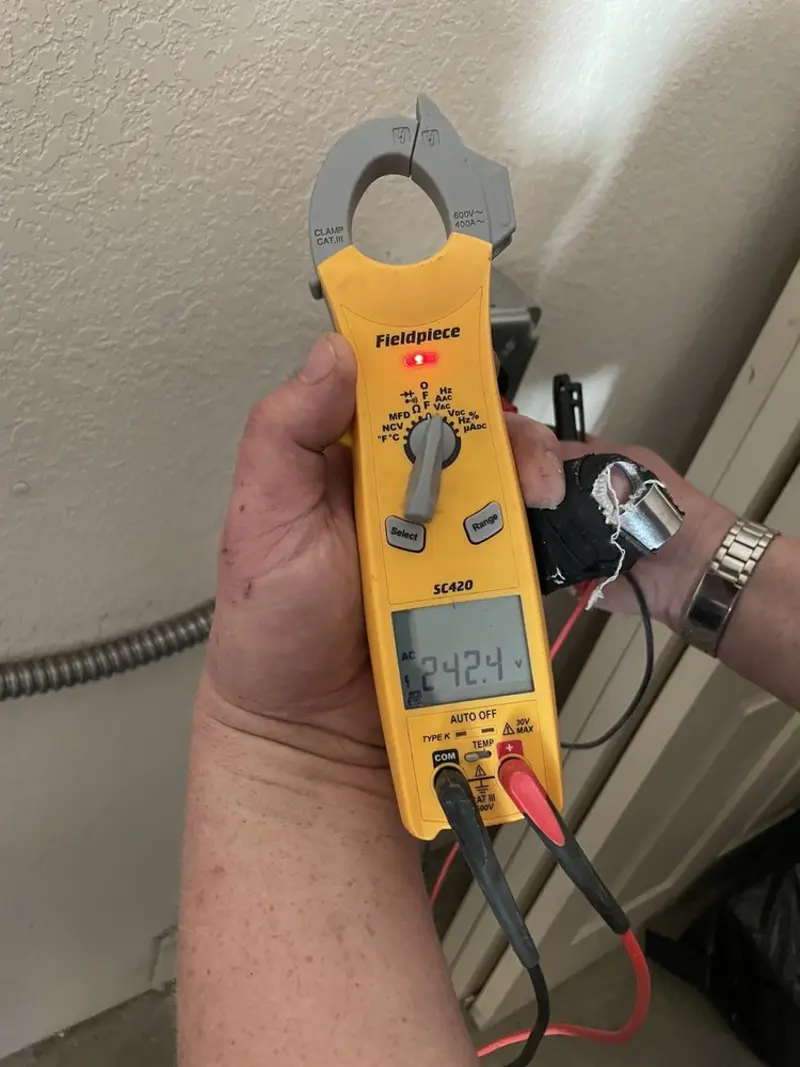 Voltage testing with clamp meter during Ceiling Fan Installation in Murraysville